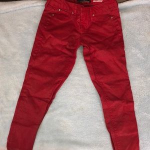 Red snakeskin jeans